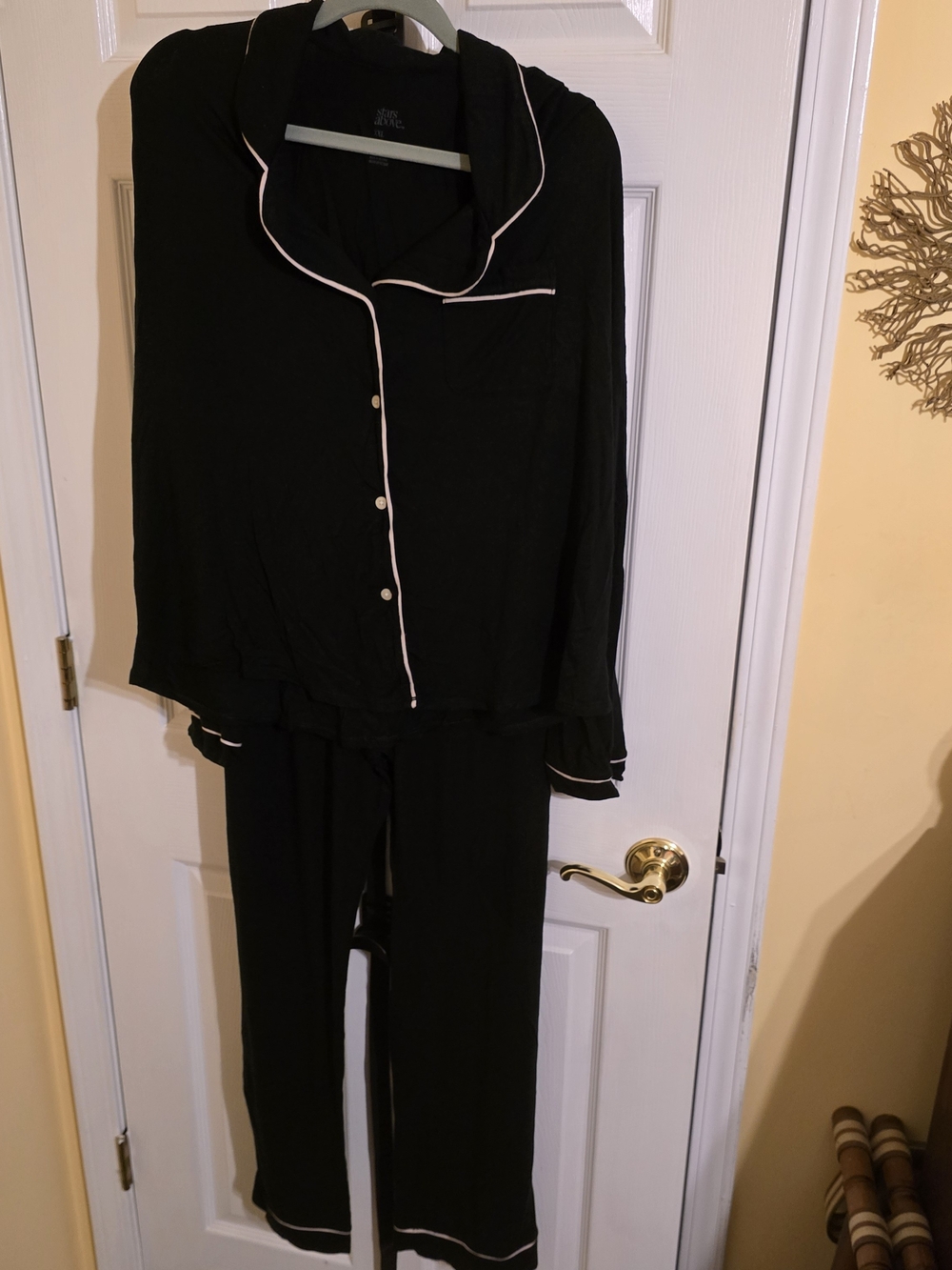 stars above Black Pajama Set with White Piping Trim